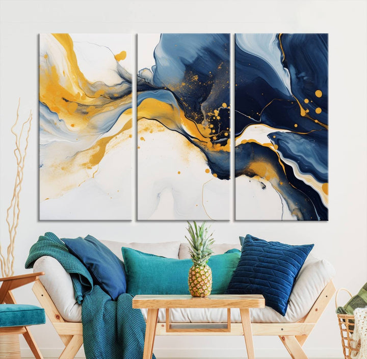 The Blue and Gold Abstract Fluid Canvas Art, with its swirling patterns, adorns the wall. This modern wall art beautifully complements the contemporary interior decor, adding an elegant touch with its rich blue, gold, and white tones.