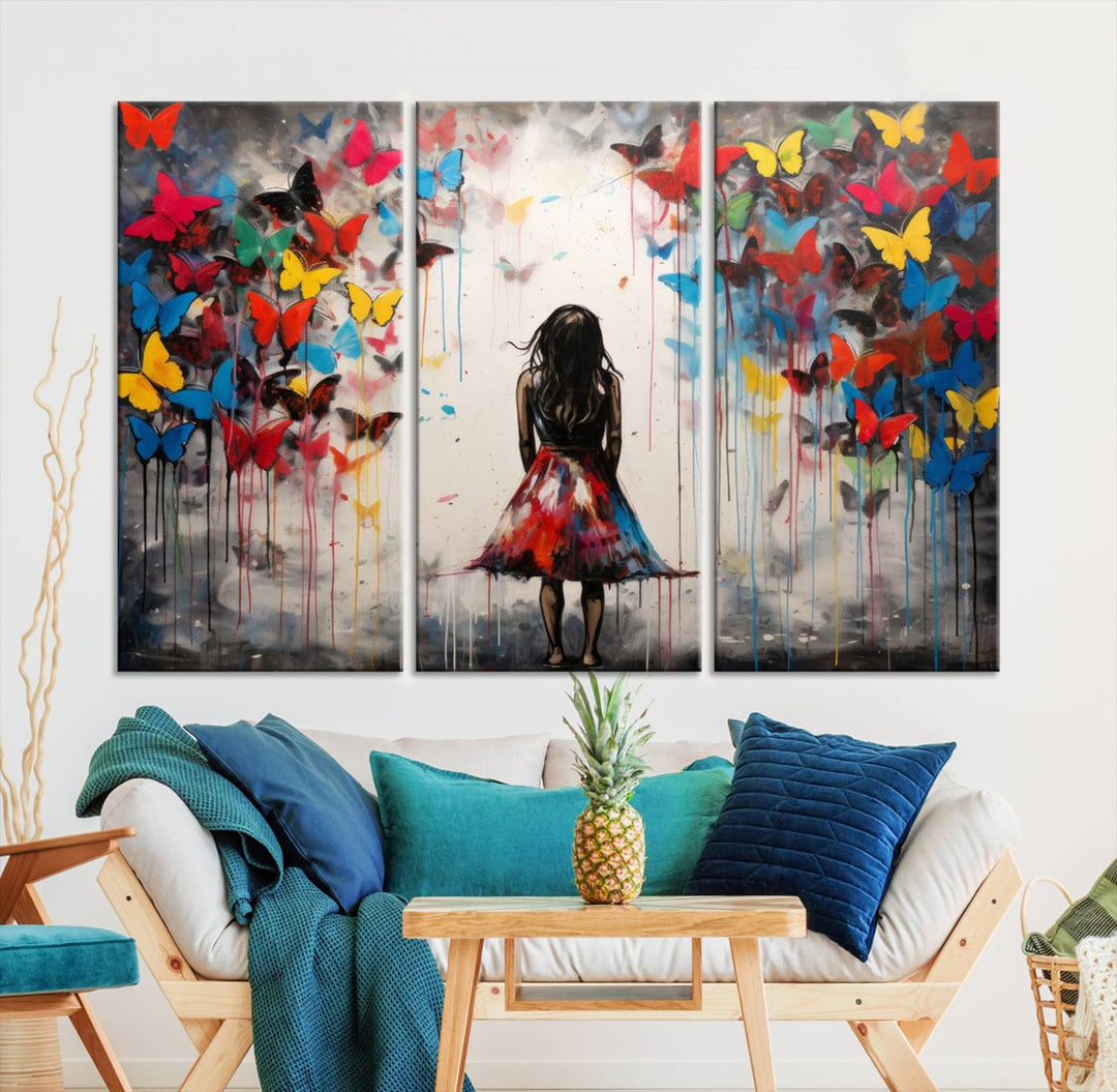 The Girl Butterfly Graffiti Abstract Canvas Print, featuring a vibrant depiction of a girl surrounded by butterflies on museum-quality canvas, is displayed prominently.