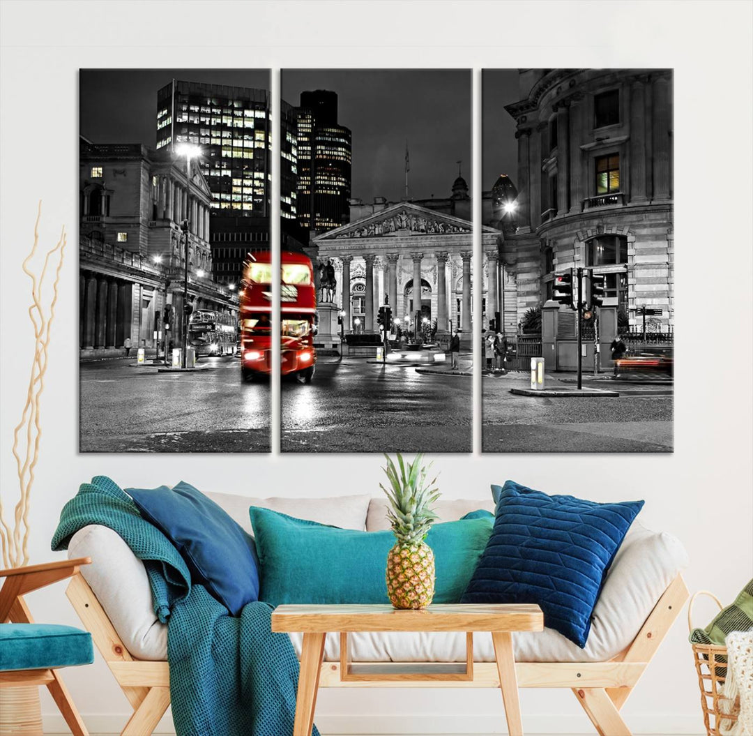 The London Night Red Bus Wall Art Canvas Print features a black and white cityscape with a moving red double-decker bus, crafted on museum-quality canvas with a UV-protective coating. This ready-to-hang artwork is designed to stand out and enhance any space.