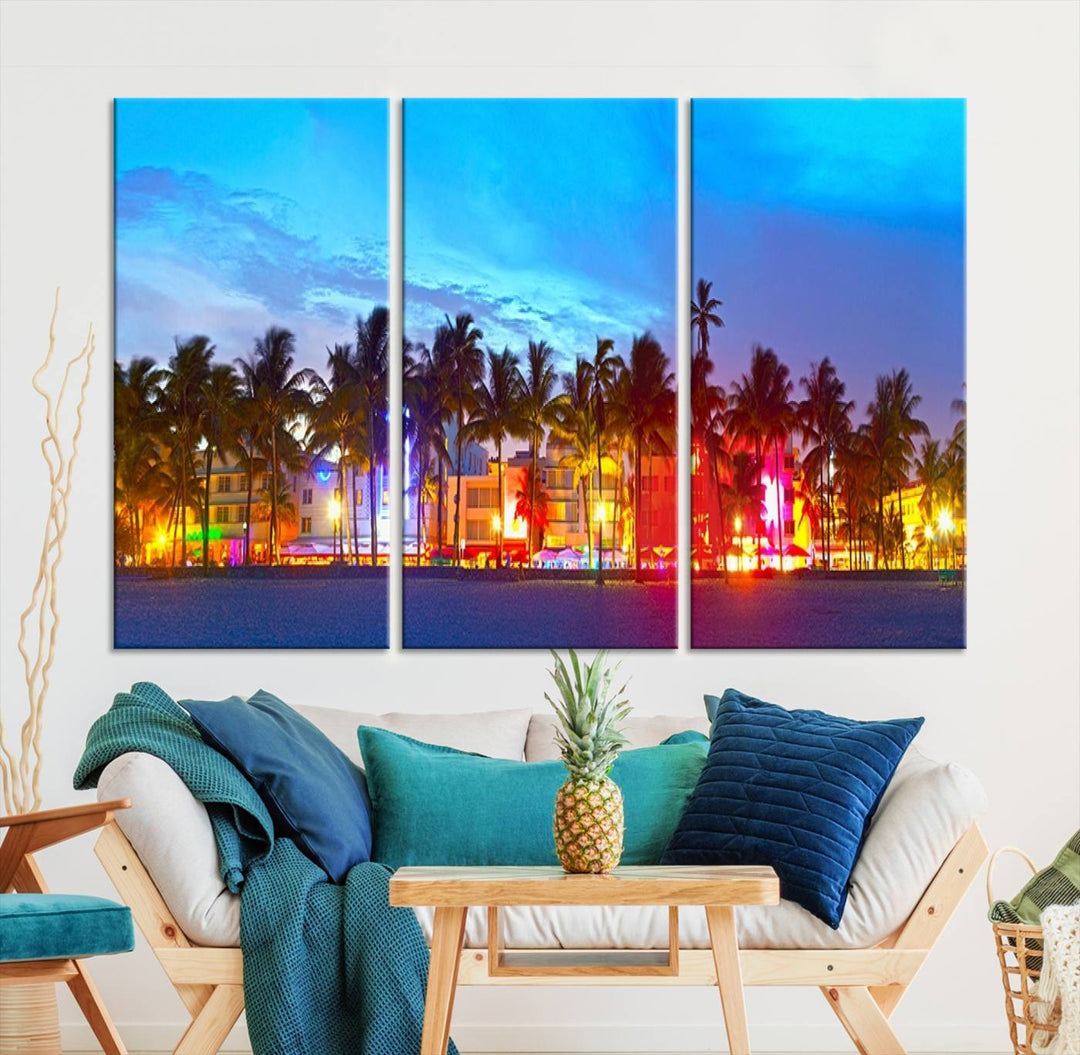 The living room features a three-panel Miami City Wall Art Canvas Print, showcasing a colorful, illuminated beach scene with palm trees on museum-quality canvas.