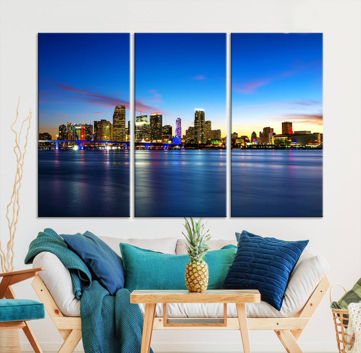 The living room features a Miami City Wall Art Canvas Print—a gallery-wrapped triptych displaying a city skyline at dusk, adding museum-quality elegance to the space.