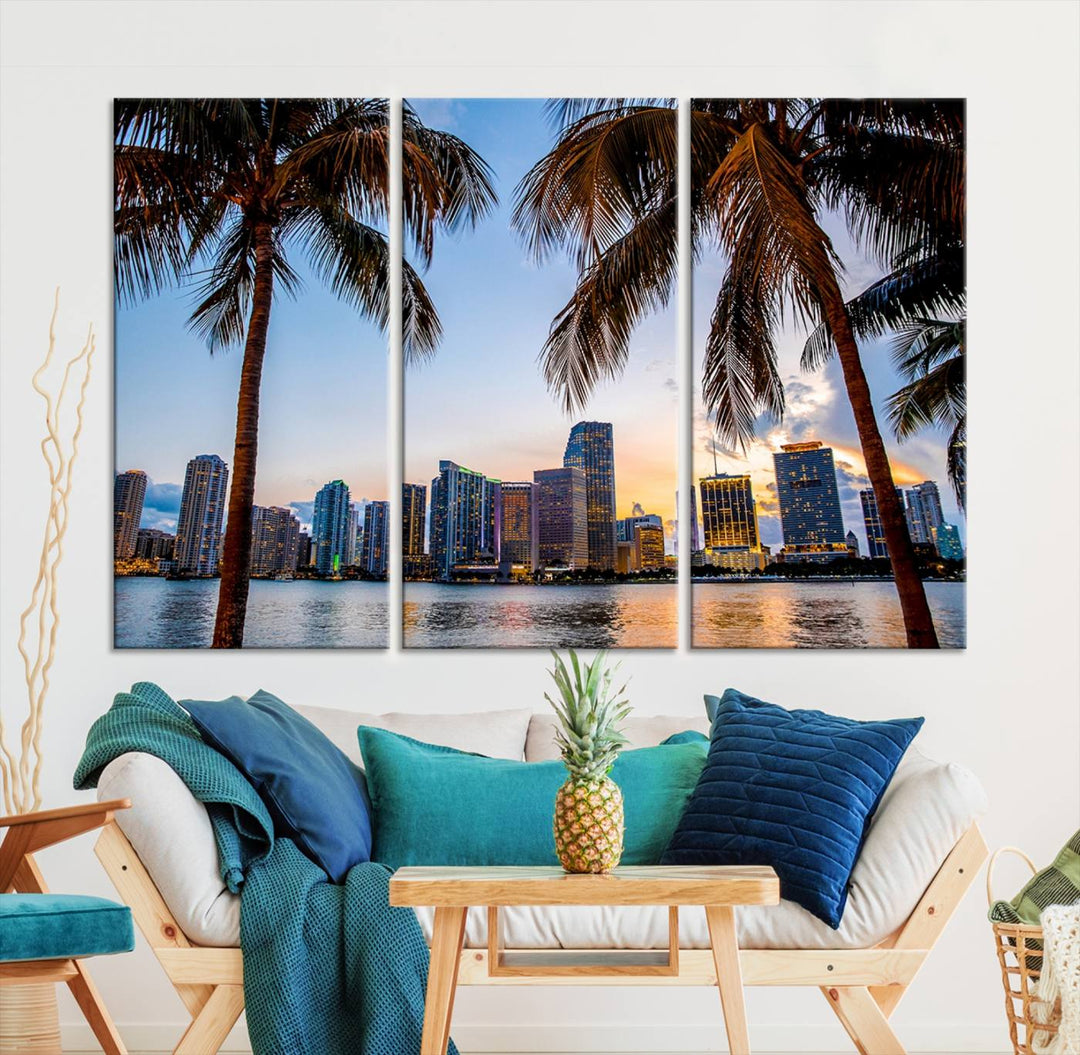 The Wall Art MIAMI Canvas Print features a triptych design depicting palm trees and a city skyline at sunset.