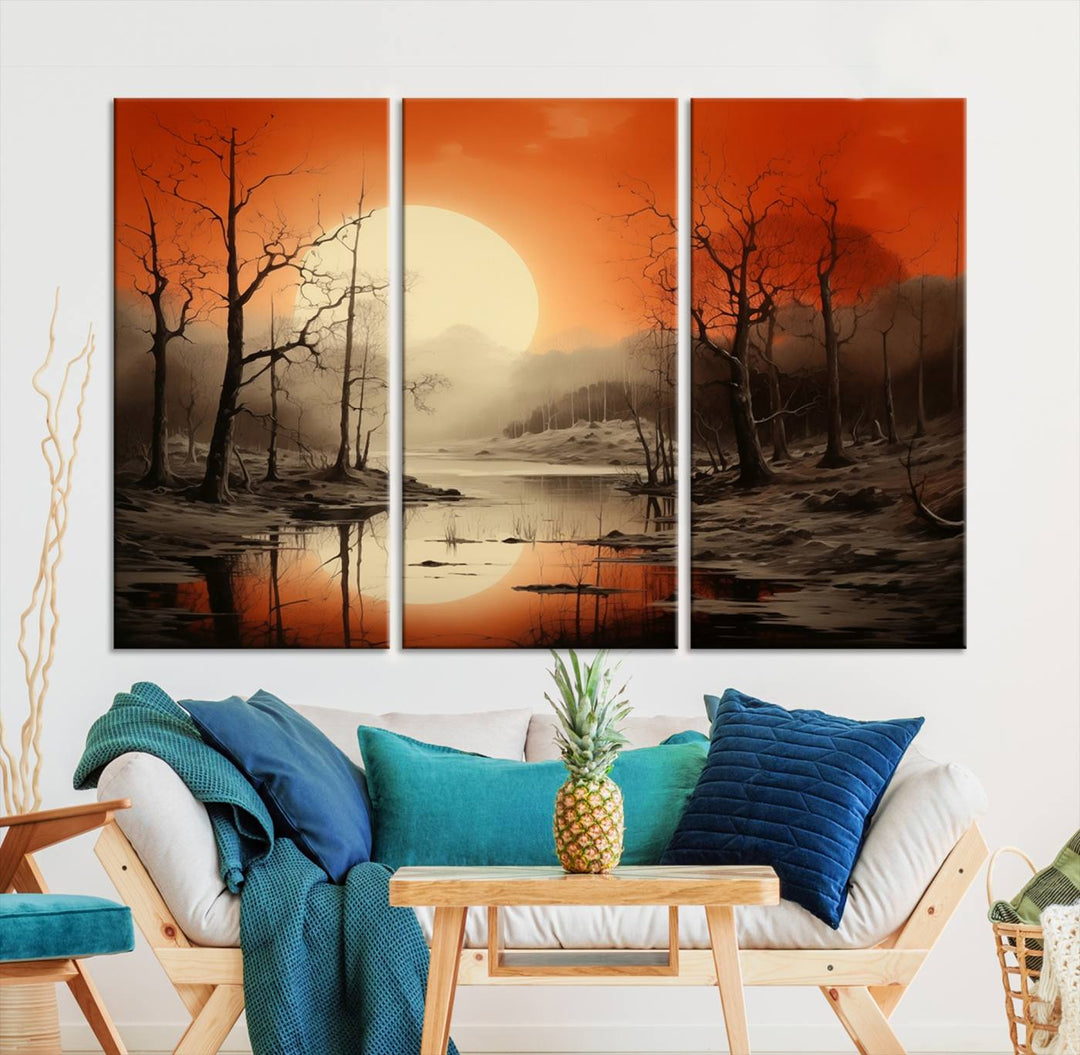 The "Abstract Watercolor Trees and Sunset on Lake Wall Art" is a triptych masterpiece, showcasing an orange-hued landscape of barren trees and a large sun. Displayed on museum-quality canvases with UV-protective coating, it creates a striking visual element in any space.