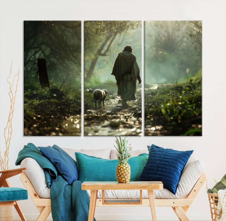 The wall art piece, titled "Jesus Shepherd a Lost Lamb Canvas Wall Art Print," is suspended on the wall and depicts a robed figure and a lamb wandering along a forest path.