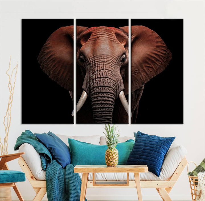 A stunning triptych titled "Wild Elephant Wall Art Canvas Print" beautifully enhances the wall above a contemporary living room. This Africa Savannah Wild Animal Wall Decor Print is of museum-quality, complete with a UV-protective coating to ensure its vibrancy and beauty are preserved for years.