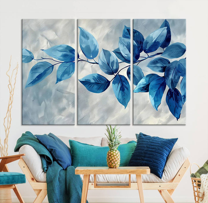 A Blue Leaf Abstract Wall Art Canvas Print, featuring a textured background and gallery-quality finish, is displayed.