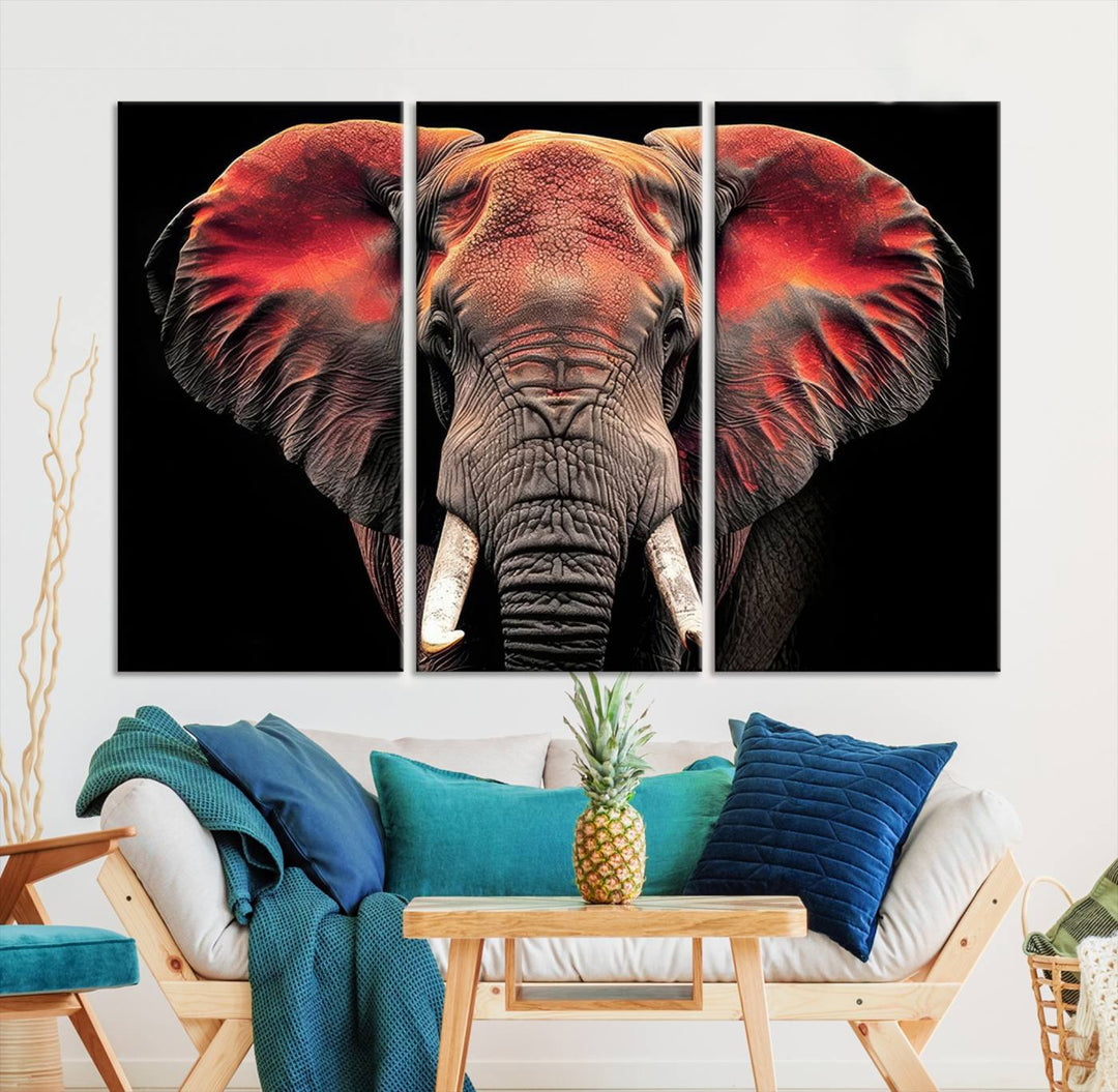 The Elephant Wall Art Canvas Print, featuring vibrant red and black tones, is a stunning artwork printed on museum-quality canvas. It comes with a UV-protective coating.