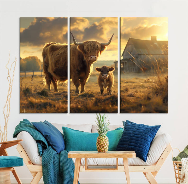 The "Highland Baby Cow Canvas Wall Art Animal Print" triptych art piece showcases a cow and calf in a sunlit field with a barn in the background.