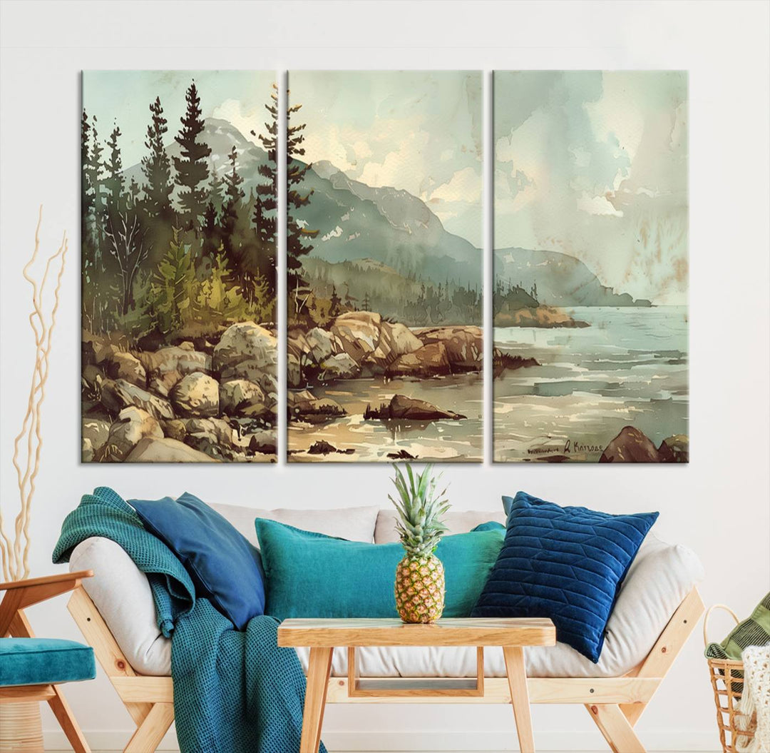 The living room features a breathtaking three-panel Abstract Acadia National Park Wall Art Canvas Print, which beautifully captures the rocky Maine coastline with trees and mountains.