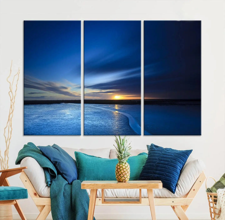 The living room features a triptych of the Wall Art Canvas Print Navy Sunset Lake Landscape Artwork, adding to its tranquil vibe.