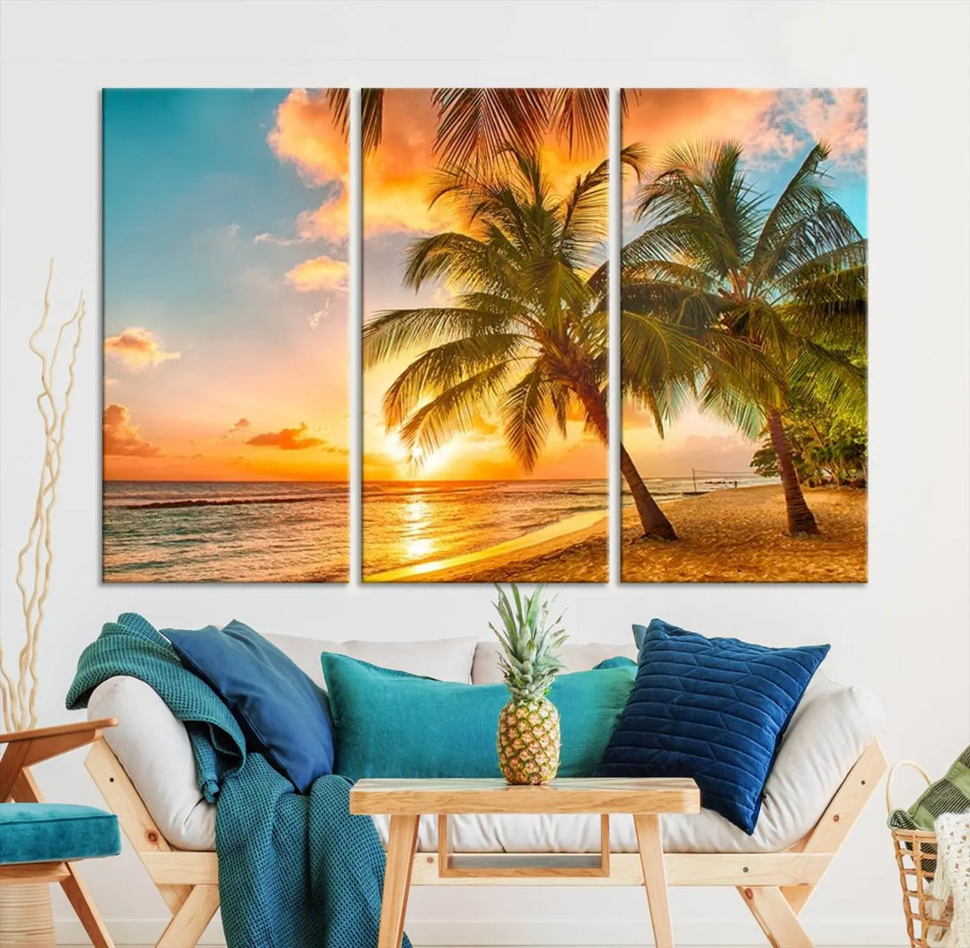 The Tropical Sunset Wall Art Print features a vibrant beach scene with palm trees and an ocean view highlighted by a golden sunset.