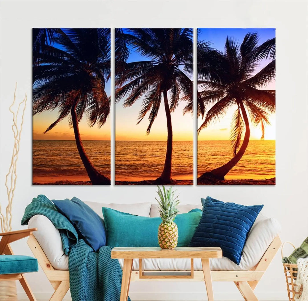 The living room features a wall adorned with the "Wall Art Canvas Curve Palms at Sunset on Beach," showcasing gallery-wrapped, museum-quality canvases in a stunning triptych.