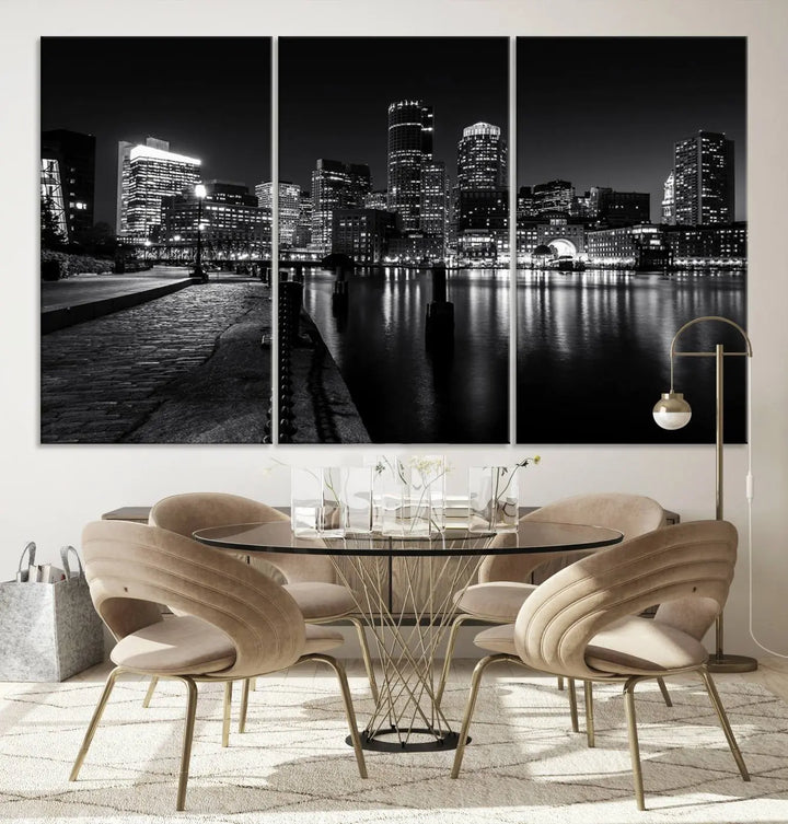 The Boston City Lights Skyline Black and White Wall Art Cityscape Canvas Print portrays a triptych of the city skyline at night reflecting on a calm river. This museum-quality canvas features UV-protective finishes to preserve its timeless allure.