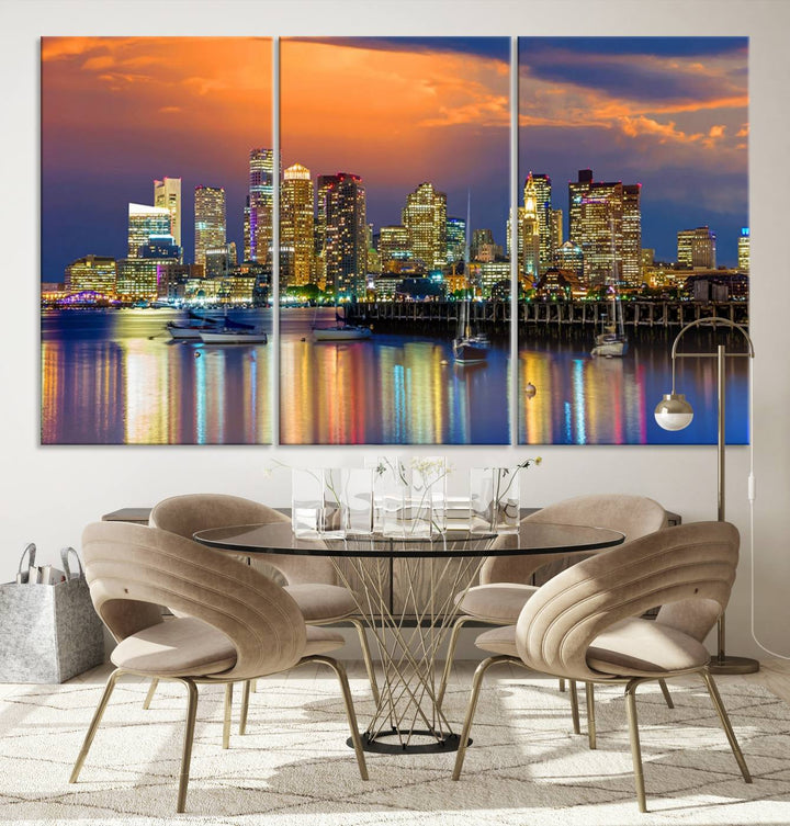 A contemporary dining area features a large triptych wall art of the Boston City Night skyline in blue and orange hues, printed on museum-quality canvases to ensure lasting beauty.