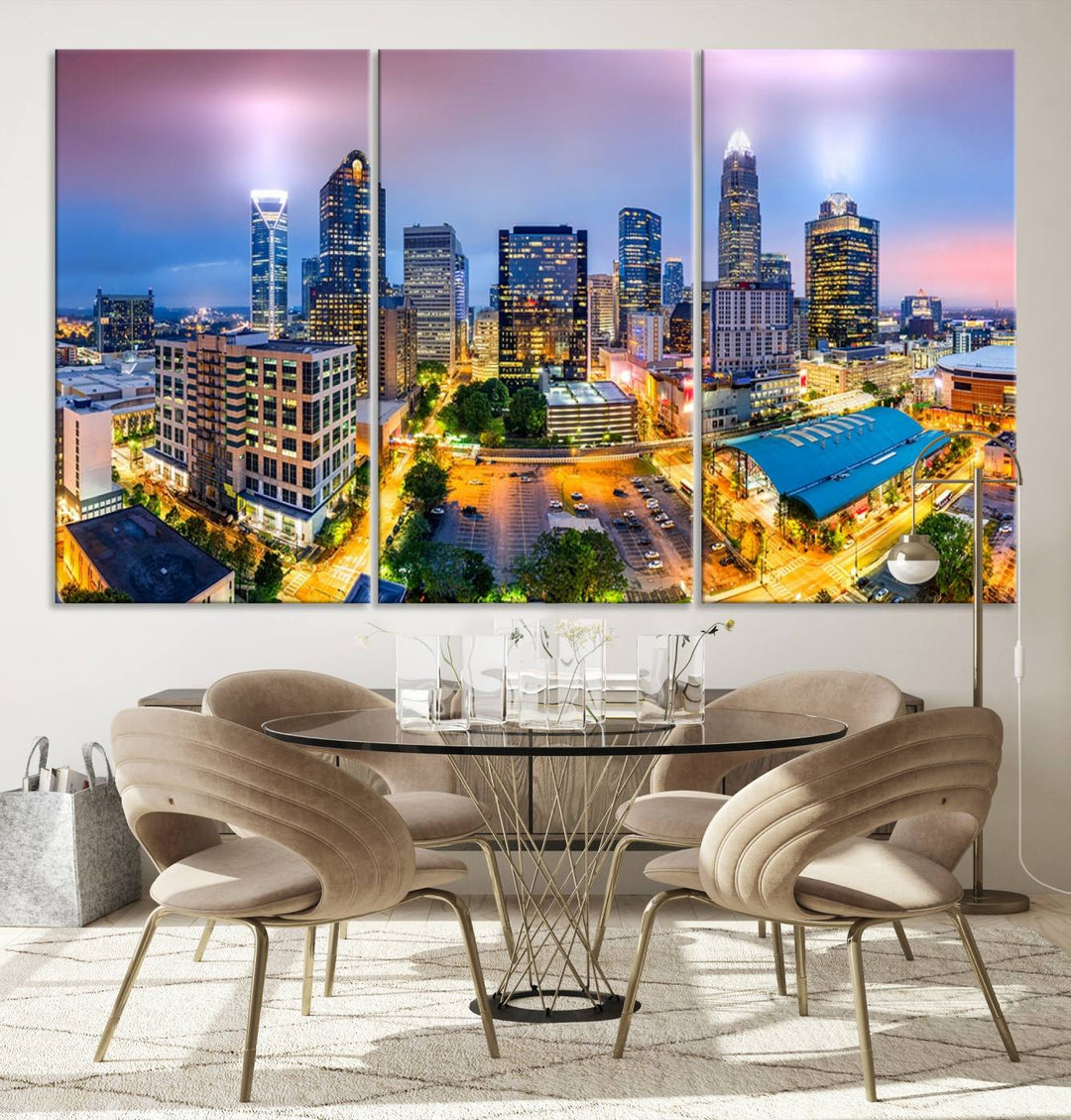 The living room features three large pieces of the *Charlotte City Lights Sunset Purple Skyline Cityscape View Wall Art Canvas Print*. Crafted on gallery-wrapped, museum-quality canvas with UV-protective coating, they grace the wall and add an artistic flair to the space.