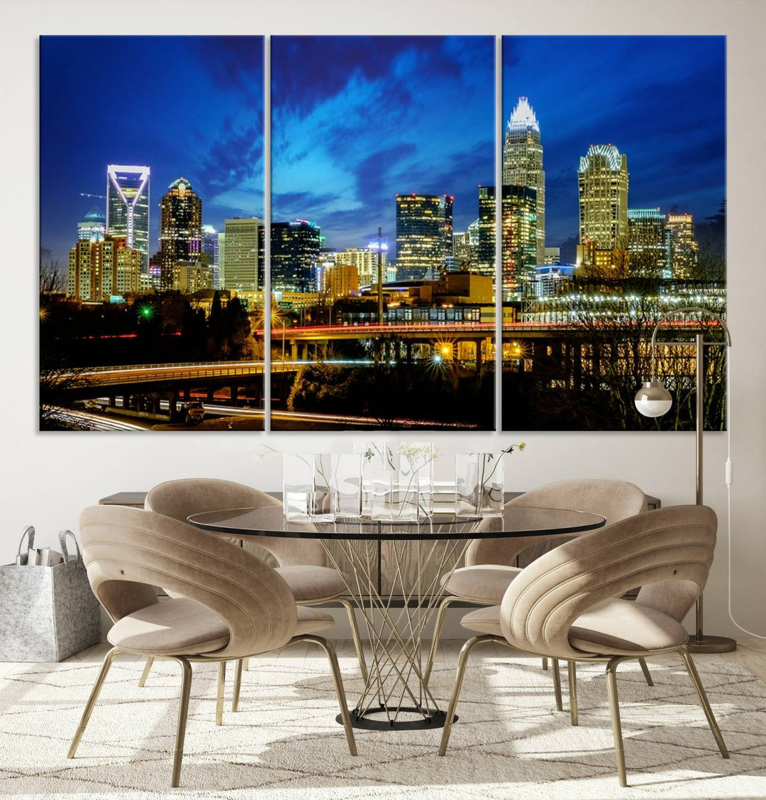 A modern living room highlighted by the "Charlotte City Lights Cloudy Blue Night Skyline Cityscape View" wall art canvas print, crafted on museum-quality canvas with UV-protective coating.