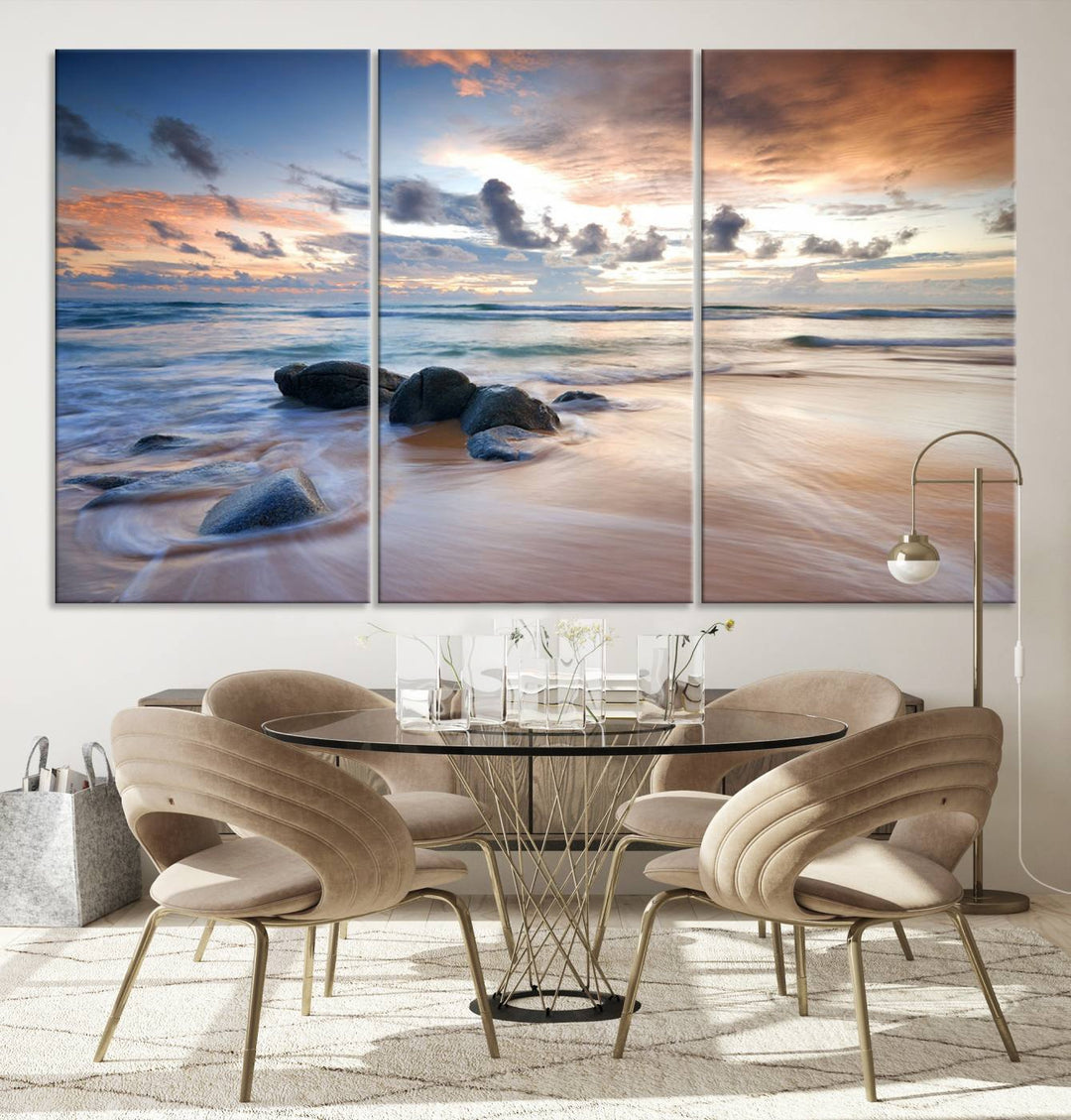 The "Serene Weather On The Beach Wall Art Canvas Print," featuring a tranquil beach scene with rocks and waves, is ready to hang and enjoy.