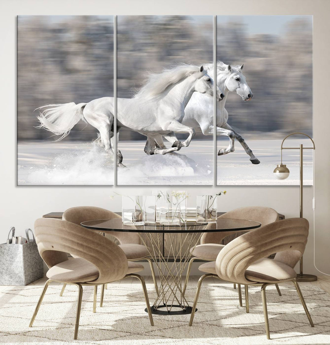 The "All The White Horses Wall Art Canvas Print" depicts a triptych of galloping white horses across a snowy landscape. These museum-quality canvases come with a UV-protective coating to maintain their stunning appearance over time.