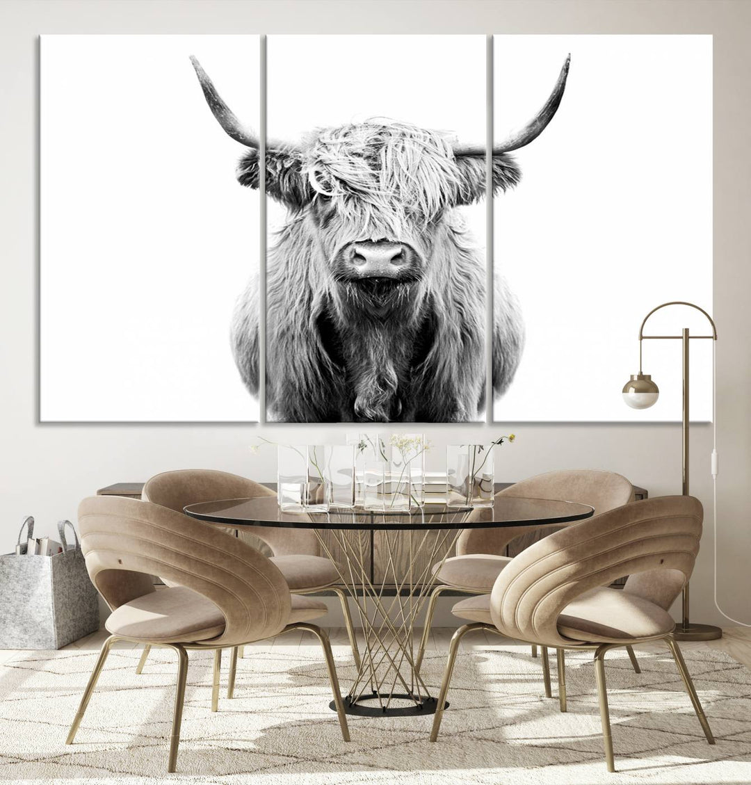 The wall art features a triptych of a Scottish Highland cow, printed on museum-quality canvases with a UV-protective coating. This decorative piece is known as the Highland Cow Canvas Wall Art Farm House Wall Art.