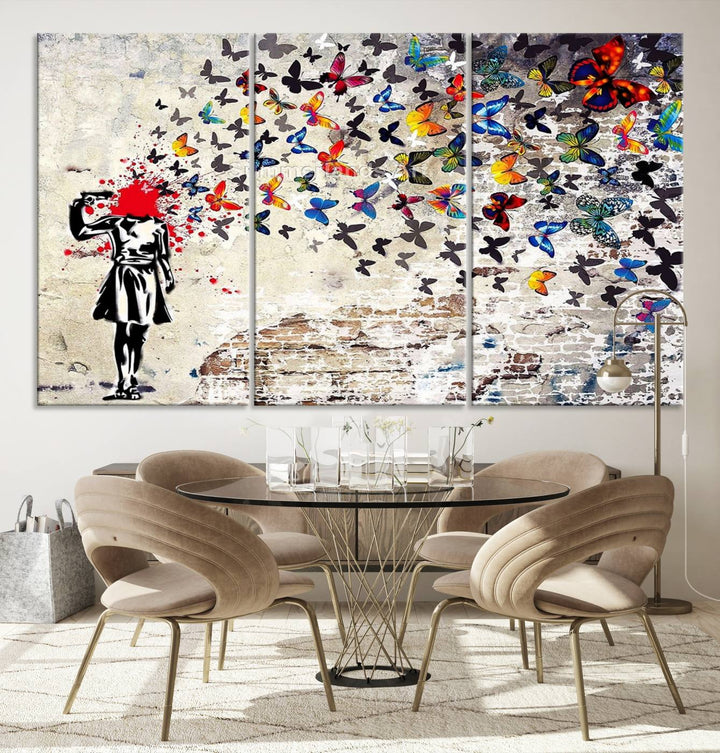 The Banksy Art Butterfly Girl Explosion Canvas showcases a dynamic figure with butterflies bursting from their head, set against a textured wall background. This vibrant urban graffiti piece is perfect for modern interiors and comes ready to hang.