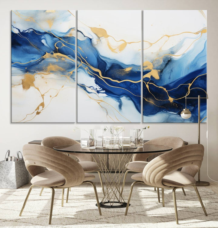 The Blue Abstract Wall Art is displayed as a triptych on museum-quality canvas, showcasing a blue and gold abstract design. The artwork includes a UV-protective coating to maintain its vibrancy and comes with the benefit of free shipping.