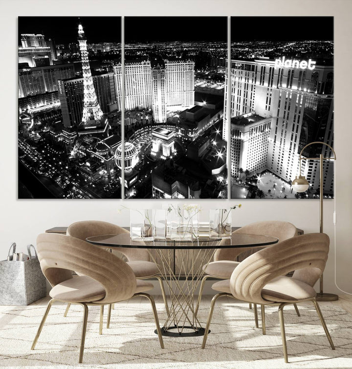 The Las Vegas Wall Art Canvas Print is a black and white triptych that showcases a city skyline at night. Crafted on museum-quality canvas with a UV-protective coating, it serves as an elegant and ready-to-hang focal point in the room.