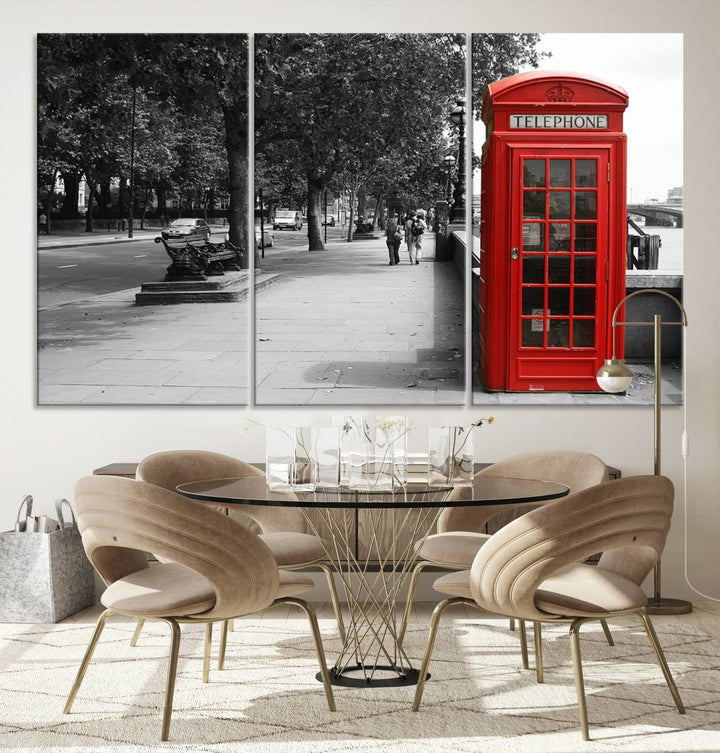 The London Phone Club Wall Art is a stunning piece that showcases a red telephone box set in a black and white street scene on museum-quality canvas. It is gallery wrapped with a UV-protective coating to preserve its vibrant charm.