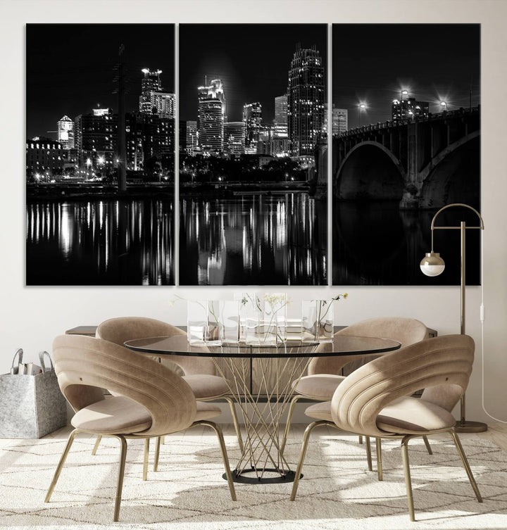 The "Minneapolis Wall Art Canvas Print, Minnesota City Wall Art Print, Minnesota Cityscapes Wall Art" features a black and white triptych of a city skyline with a bridge. Crafted on museum-quality canvas, this gallery-wrapped artwork is finished with a UV-protective coating to ensure lasting beauty.