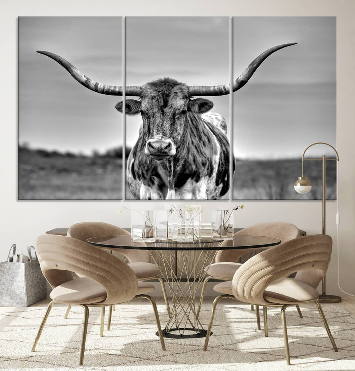 The Texas Longhorn Cow Wall Art, featuring a black and white image of a longhorn bull on canvas, brings charm to the room with its sophisticated appeal.