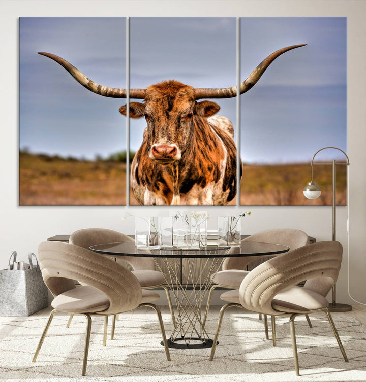 The Texas Longhorn Wall Art Print, a triptych canvas artwork depicting a longhorn bull in a field, features a gallery-quality finish.