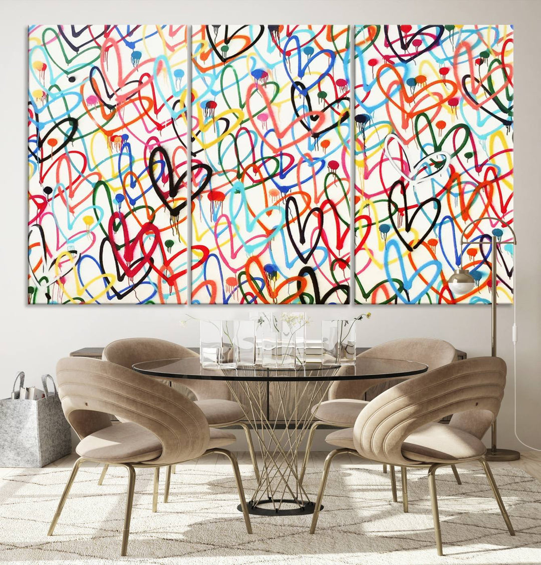 The Colorful Graffiti Love Canvas Print, a street art masterpiece with vibrant abstract swirls and a gallery-quality finish, hangs prominently on the wall.