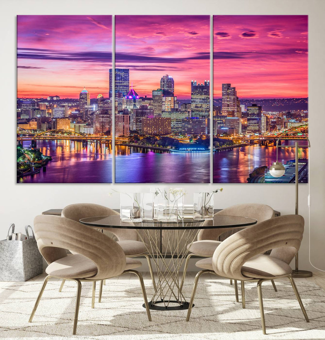 The Pittsburg Wall Art Canvas Print, showcasing a vibrant sunset glow over the city skyline and crafted by a professional artisan, adorns the space.