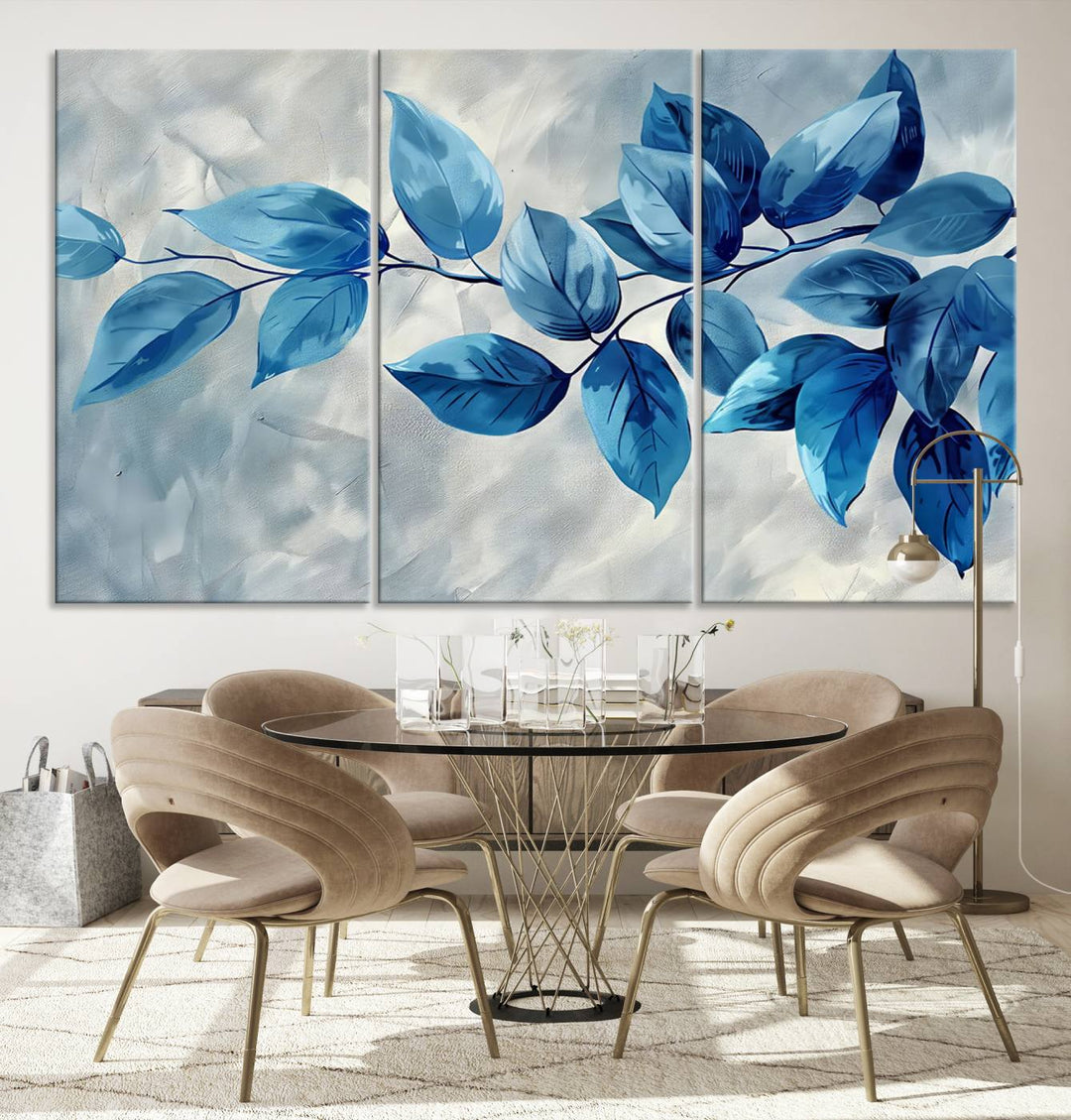 A Blue Leaf Abstract Wall Art Canvas Print, featuring a textured background and gallery-quality finish, is displayed.