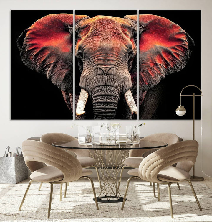 The Elephant Wall Art Canvas Print, featuring vibrant red and black tones, is a stunning artwork printed on museum-quality canvas. It comes with a UV-protective coating.