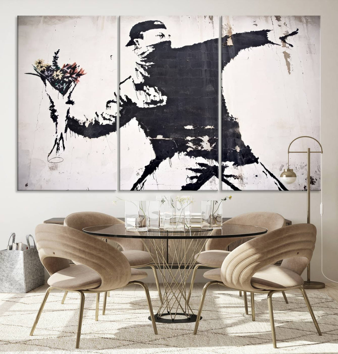 The living room features a split-panel art piece named "Banksy Flower Throw Graffiti Street Wall Art Canvas Print," gallery wrapped on museum-quality polycotton canvas and accentuated by modern decor elements.