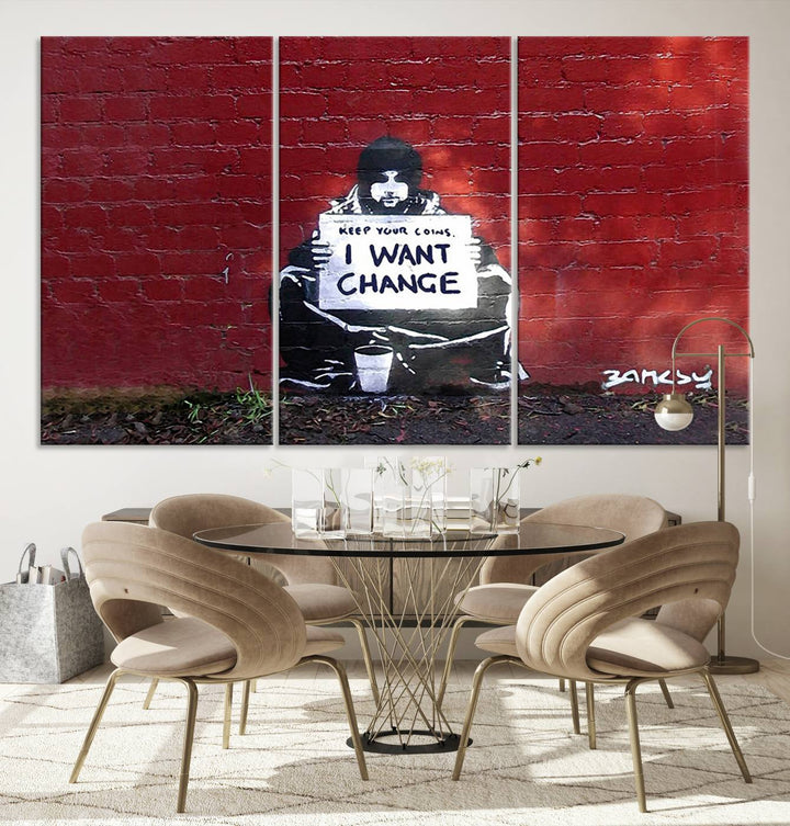 The living room showcases a triptych of stencil artwork on museum-quality canvas, featuring the Banksy I Want Change Graffiti Abstract Wall Art Canvas Print. This captivating piece depicts a person holding a sign that says "I want change" and is finished with a UV-protective coating to ensure long-lasting beauty.