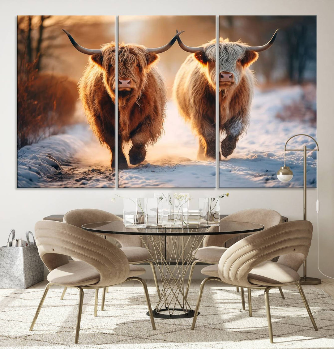 The living room showcases a triptych from the Scottish Highland Cow Horn Farm Wall Art Canvas Print collection, depicting two Highland cows running in the snow. Complementing this are handmade wall art pieces with a gallery-quality finish that add an elegant touch.