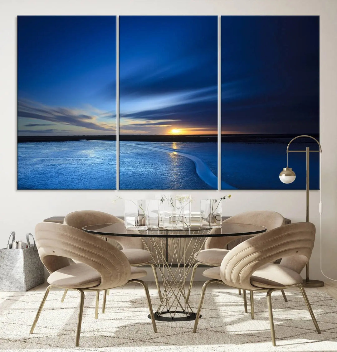 The living room features a triptych of the Wall Art Canvas Print Navy Sunset Lake Landscape Artwork, adding to its tranquil vibe.