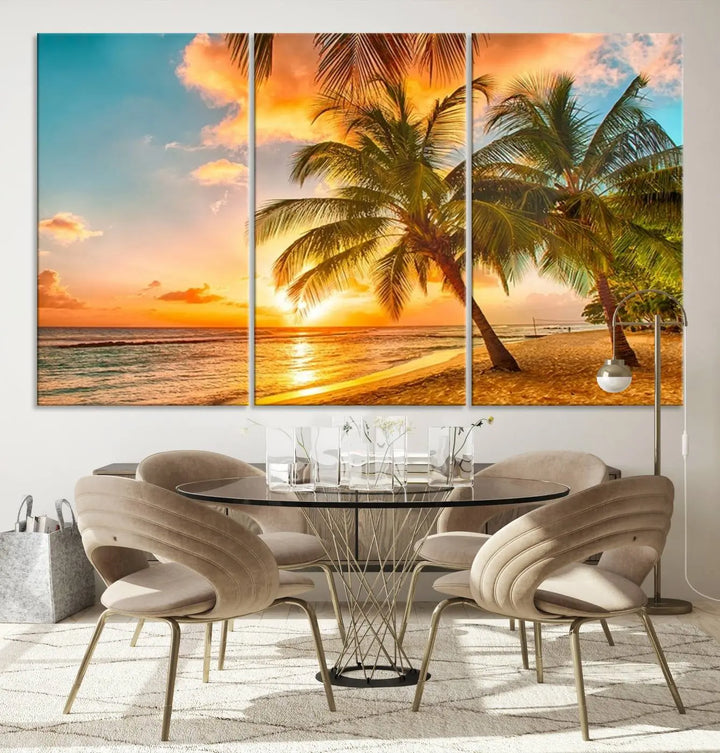 The Tropical Sunset Wall Art Print features a vibrant beach scene with palm trees and an ocean view highlighted by a golden sunset.