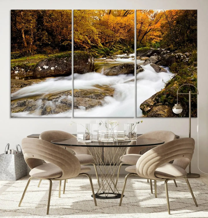 The living room is adorned with the "Wall Art Waterfall Canvas Print River in Forest in Autumn," a triptych on museum-quality canvas showcasing a flowing river surrounded by autumn trees. This ready-to-hang artwork features a UV-protective coating to ensure enduring vibrancy.