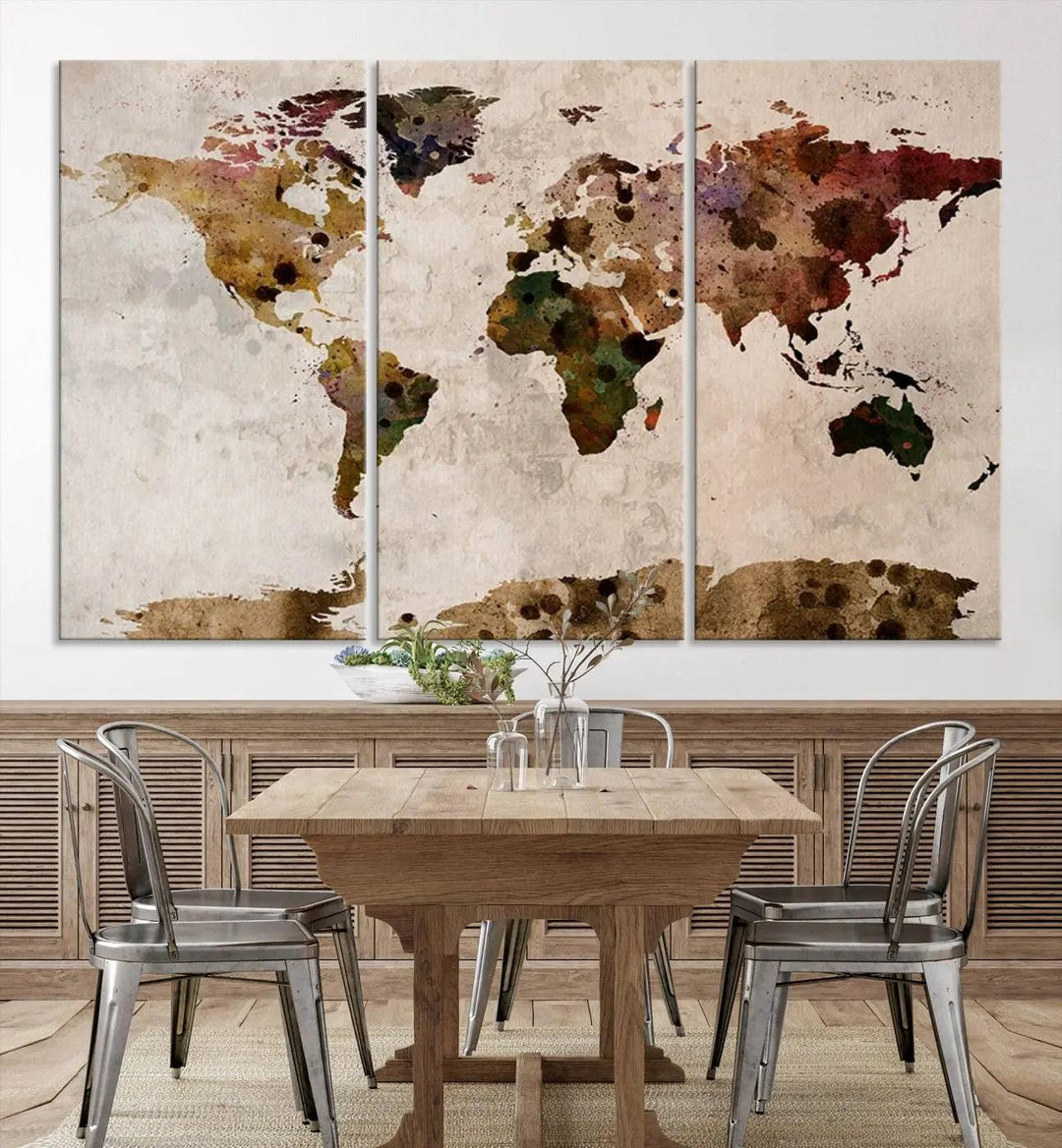 A Watercolor World Map Canvas Print, wrapped in an elegant gallery style, hangs on the wall.