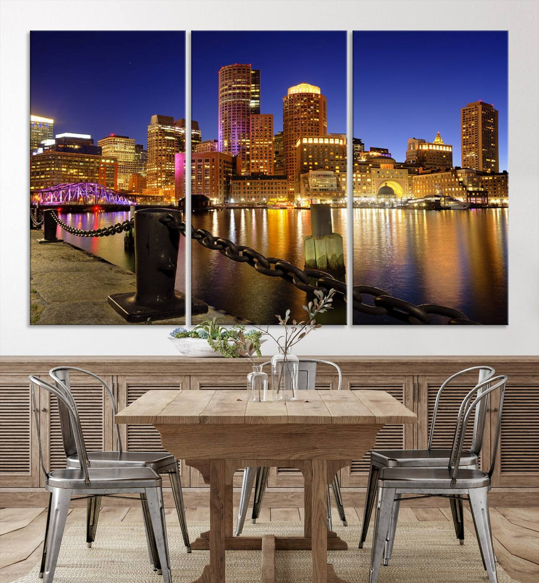 The "Boston City Night Skyline Cityscape View Wall Art Canvas Print" beautifully portrays a stunning triptych of a city skyline illuminated against the night sky, elegantly reflected in the river below. These museum-quality canvases are gallery wrapped to ensure an elegant presentation that enhances any space.