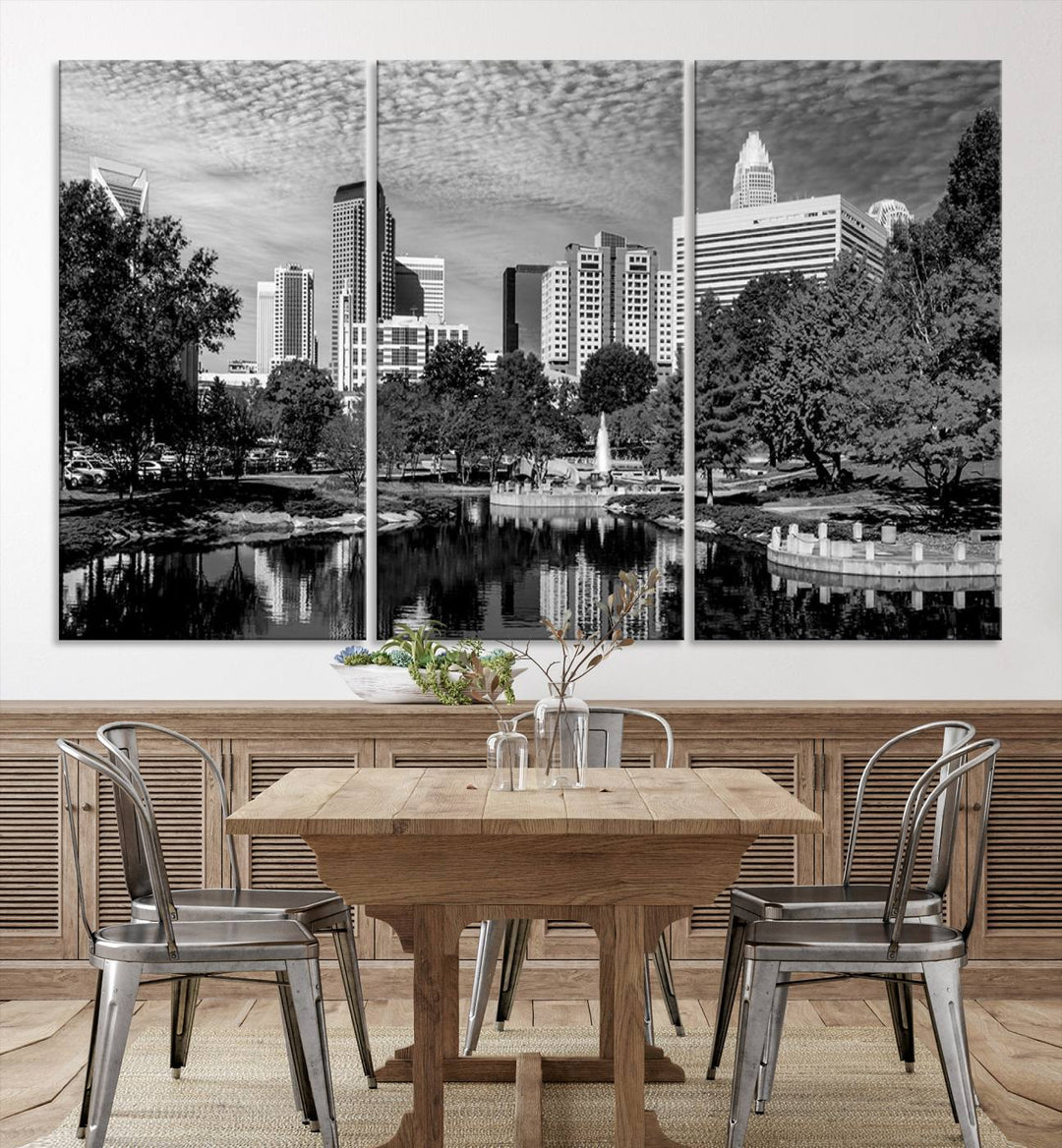 The living room features a captivating triptych titled "Charlotte City Cloudy Skyline Black and White Wall Art Cityscape Canvas Print," crafted on museum-quality canvas with UV-protective coating. Modern decor accentuates the dynamic scene.