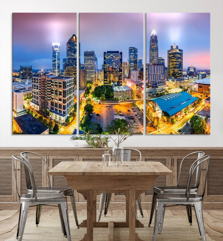 The living room features three large pieces of the *Charlotte City Lights Sunset Purple Skyline Cityscape View Wall Art Canvas Print*. Crafted on gallery-wrapped, museum-quality canvas with UV-protective coating, they grace the wall and add an artistic flair to the space.