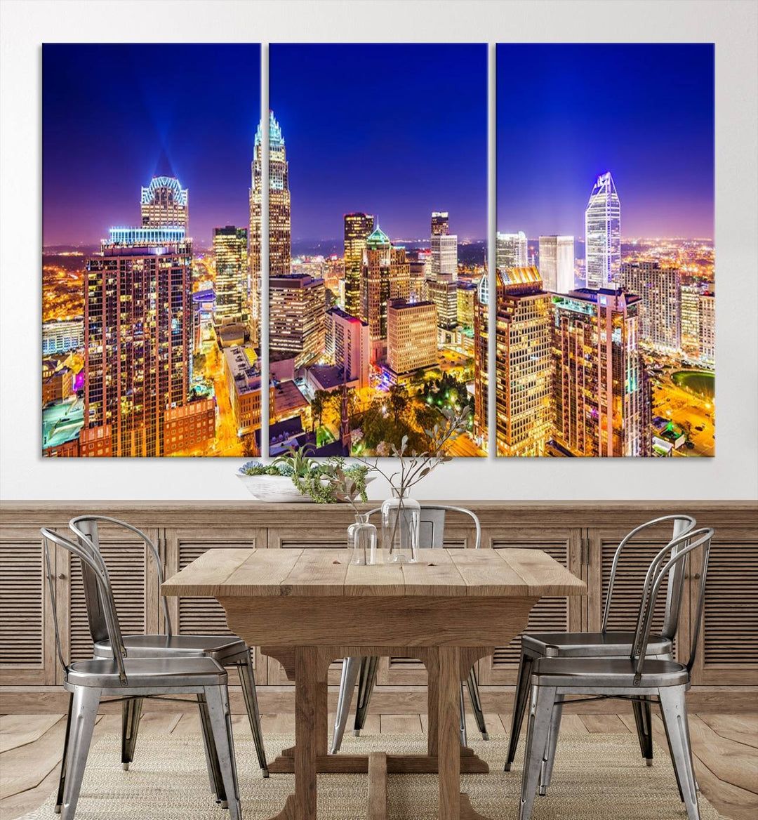 A modern living room features the Charlotte City Lights Night Blue Skyline Cityscape View wall art canvas print.