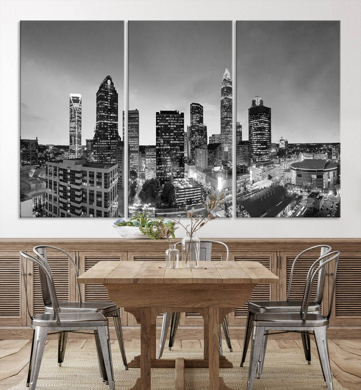 The "Charlotte City Cloudy Skyline Black and White Wall Art Cityscape Canvas Print" hangs on a dark wall, showcasing its UV-protective properties for enduring beauty.