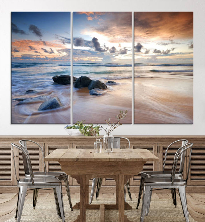 The "Serene Weather On The Beach Wall Art Canvas Print," featuring a tranquil beach scene with rocks and waves, is ready to hang and enjoy.