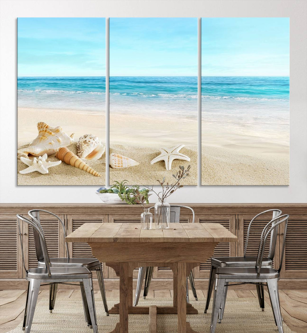 The "Turquoise Ocean View Seashell Starfish on the Beach Canvas Print Artwork" is a triptych piece that showcases a tranquil beach scene, complete with seashells and starfish adorning the sand. It is elegantly gallery-wrapped on museum-quality canvas.