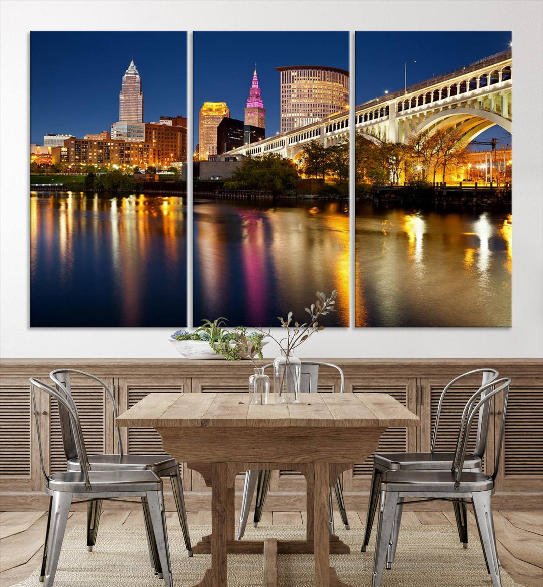 The "Cleveland Night Skyline Wall Art City Cityscape Canvas Print" is a striking feature in the room, showcasing a city skyline with a bridge reflecting in a river. Displayed on museum-quality canvas, it offers enduring beauty.