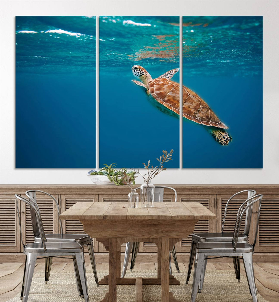 The living room features the "Baby Turtle in Ocean" wall art canvas print. This gallery-quality piece, depicting a sea turtle swimming underwater, adds an elegant touch to the space.